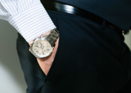 hand in pocket with look at luxury watch