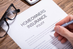 reviewing a homeowners insurance policy physical document